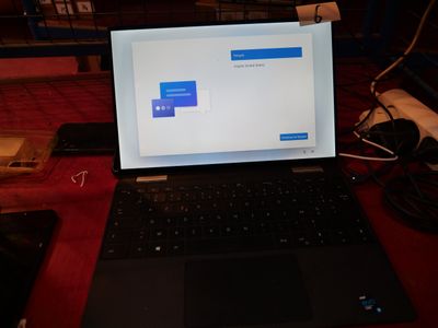 a laptop computer sitting on a desk with a mouse and keyboard