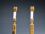 pair of brass table lamps with white glass shades