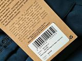 the back of a blue jacket with a label on it