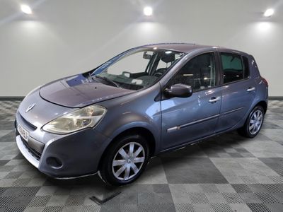 a picture of a grey car parked in a garage