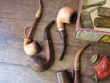 a lot of different types of pipes on the table