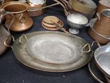 many pots and pans that are on a table