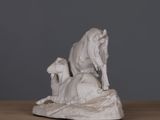 a statue of a cow and two sheep on a table
