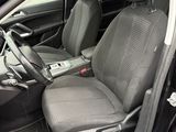 the interior of a car with the door open showing the driver ' s seat
