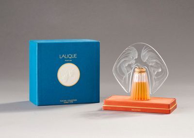an image of a glass angel figurine next to a blue box