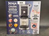 packaging of a blender with a blender in it sitting on a table