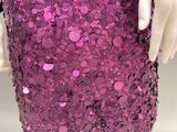 purple sequinized sequinized dress with buttons and buttons on the skirt