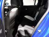 a blue car that is sitting in the back of the car
