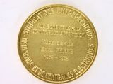 an image of a close up of a gold coin on a white surface