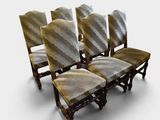 four chairs that are sitting next to each other