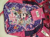 a pink bag with a picture of a girl ' s face on it