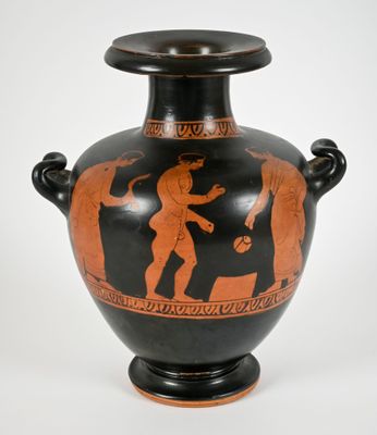 a black vase with a red and black design on it