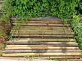 a pile of wood that is sitting in the grass