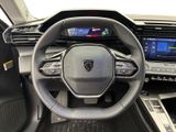 the interior of a car with a steering wheel and dashboard controls
