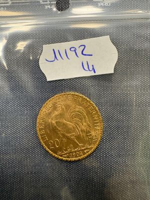 a close up of a coin in a plastic bag on a table