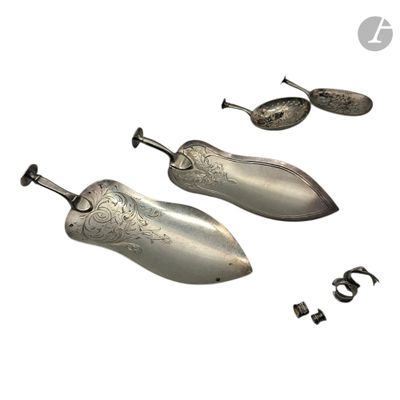 three pairs of silver shoes are shown on a white background