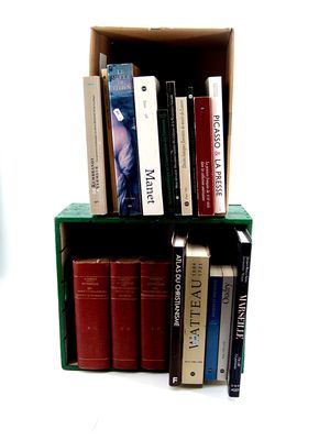 many books that are sitting on a shelf in a box