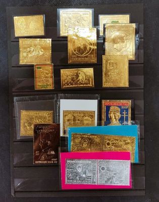 a bunch of gold and silver cards on display in a glass case