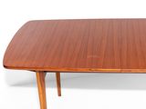 a wooden table with two legs on a white background