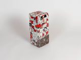 an image of a red and white vase sitting on top of a white surface