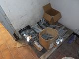 a box of tools sitting on the floor in the corner of a room