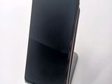 a cell phone that is sitting on top of a stand
