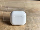 an apple airpods are sitting on top of a wooden table