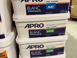 four containers of apro white paint stacked on top of each other