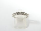 a close up of a wedding ring on a white background
