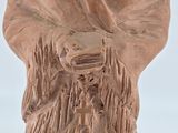 statue of a man with a beard and a shawl on a white background