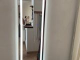a mirror that is on the wall in the bathroom