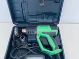 an image of a green and black tool in a black case