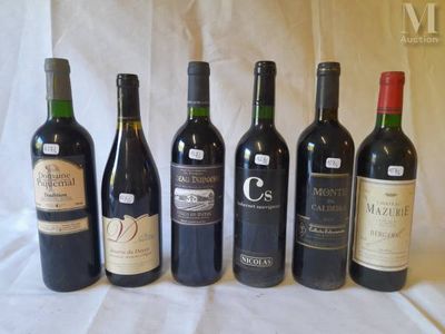 several bottles of wine are lined up in a row on a table