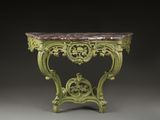 une table verte avec un plateau en marbre sur fond noir