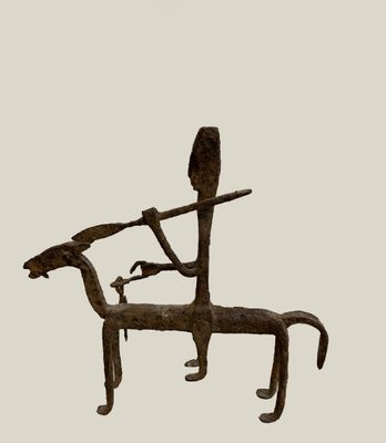 statue of a man on a horse with a bird on its back