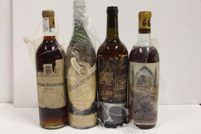 several bottles of liquor are lined up on a table
