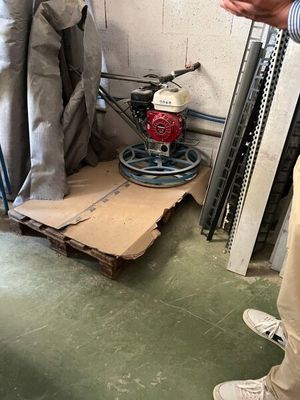 a man that is standing in a room with a machine