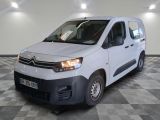 the white van is parked on a checkered floor in a room