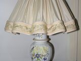 a lamp that is sitting on a table with a lamp shade on it