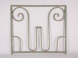 a metal frame with a decorative design on it