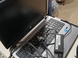 a laptop computer sitting on top of a table