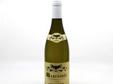 a bottle of wine that is sitting on a table