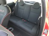 the back seats of a car are black with red stitching