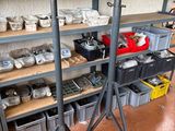 many shelves with various items on them in a room