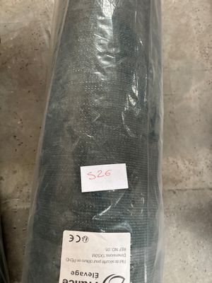 a picture of a roll of green fabric on the floor