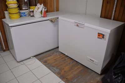 an image of a small white refrigerator in a kitchen