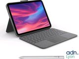 une image représentant un ordinateur portable avec un stylo à côté