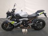 bmw motorcycle parked on a black and white checkered floor