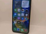 a close up of a cell phone sitting on top of a table