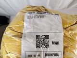 a bag of bread wrapped in plastic on a table